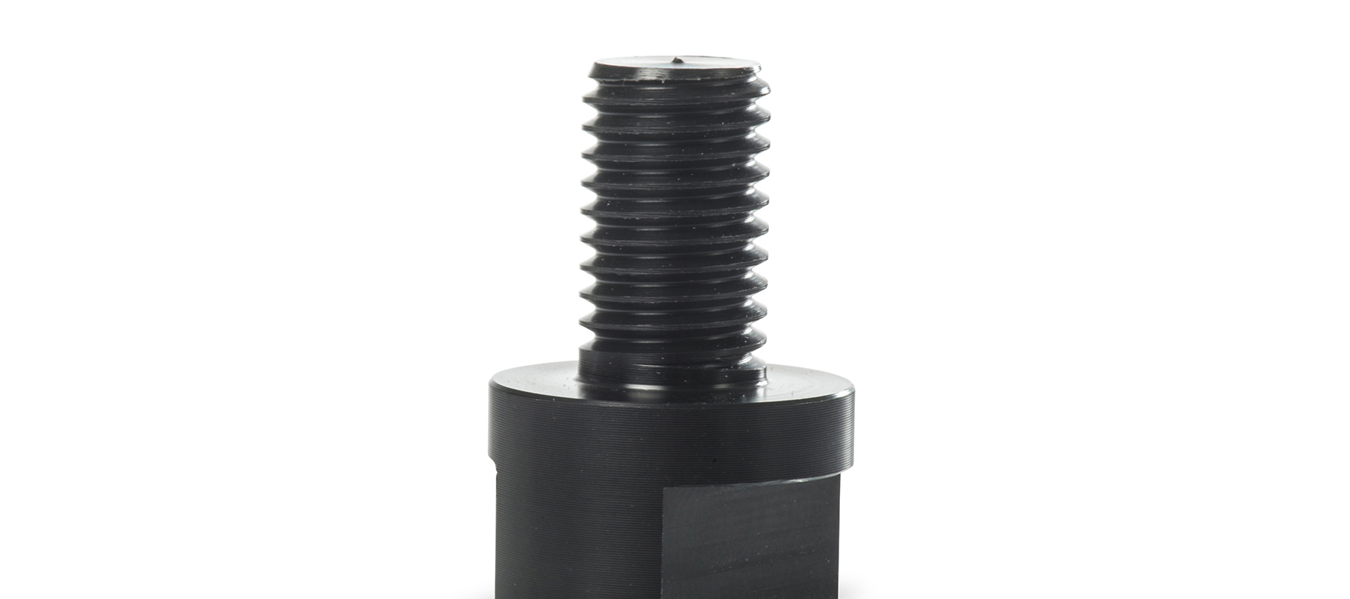 Drejet plastemne lavet hos Induflex med gevind i sort teknisk plast