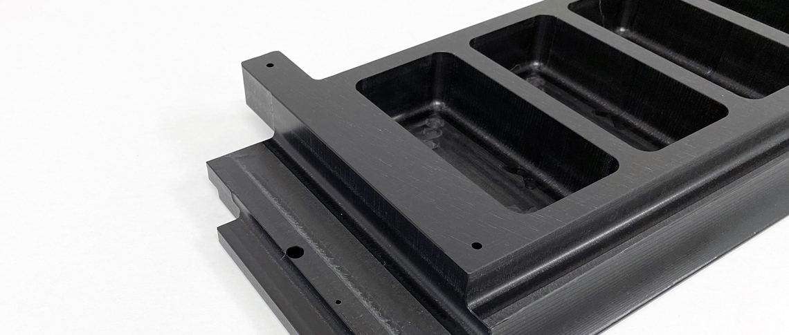 Custom-made machine part in black POM plastic