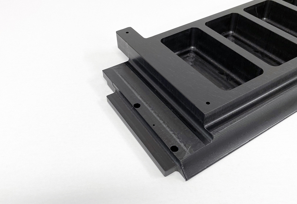 Custom-made machine part in black POM plastic