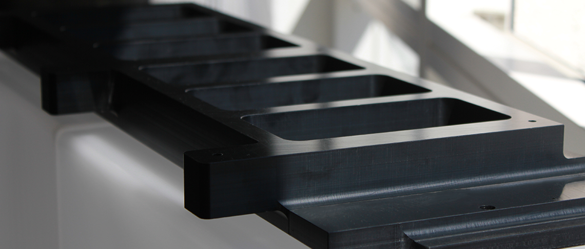 Custom-made machine part in black POM plastic