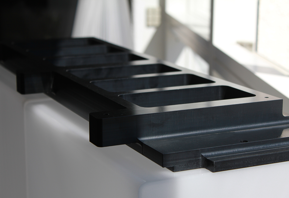 Custom-made machine part in black POM plastic