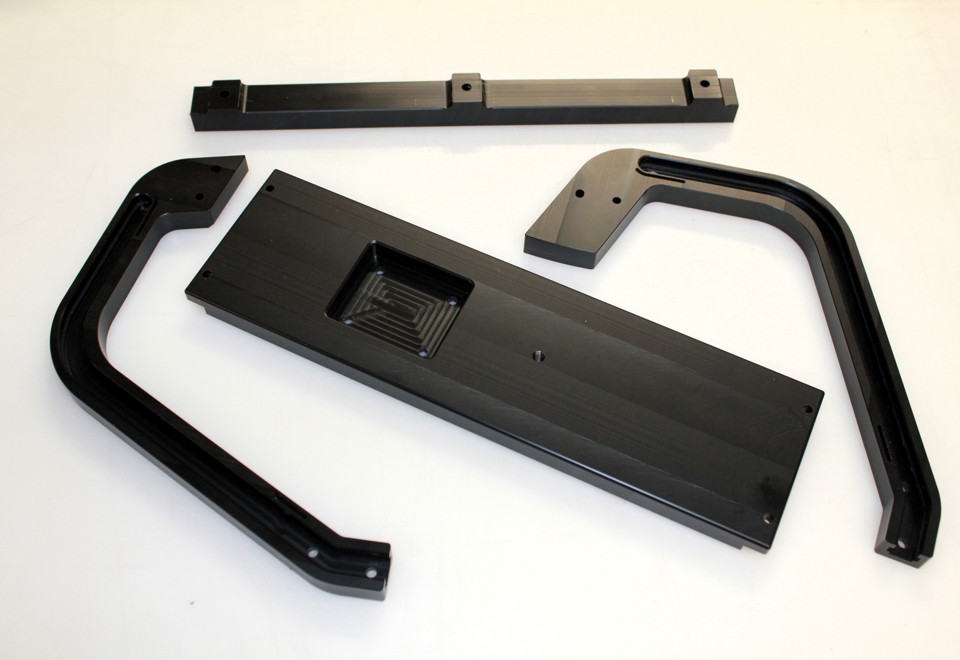 Different black PEHD components that has been produced in our CNC-milling machine.