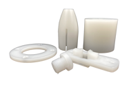 Five machine parts made of PVDF on a black background