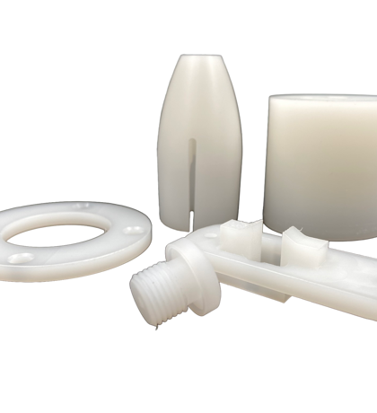 Five machine parts made of PVDF on a black background