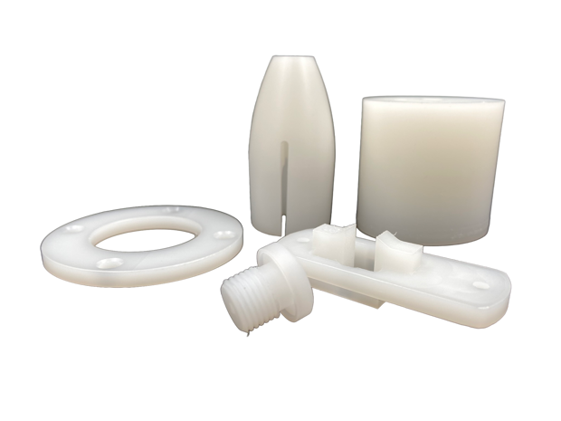 Five machine parts made of PVDF on a black background