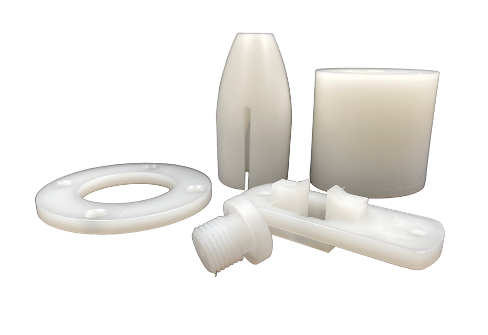 Five machine parts made of PVDF on a black background