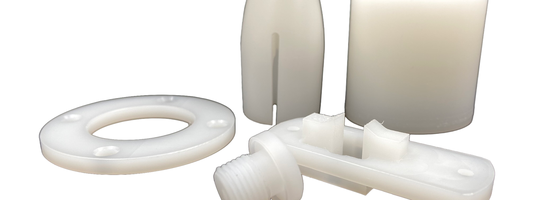 Five machine parts made of PVDF on a black background