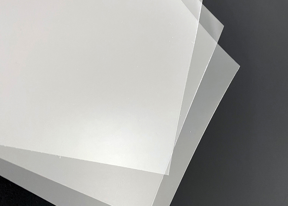 Sheets of clear PET on a black background