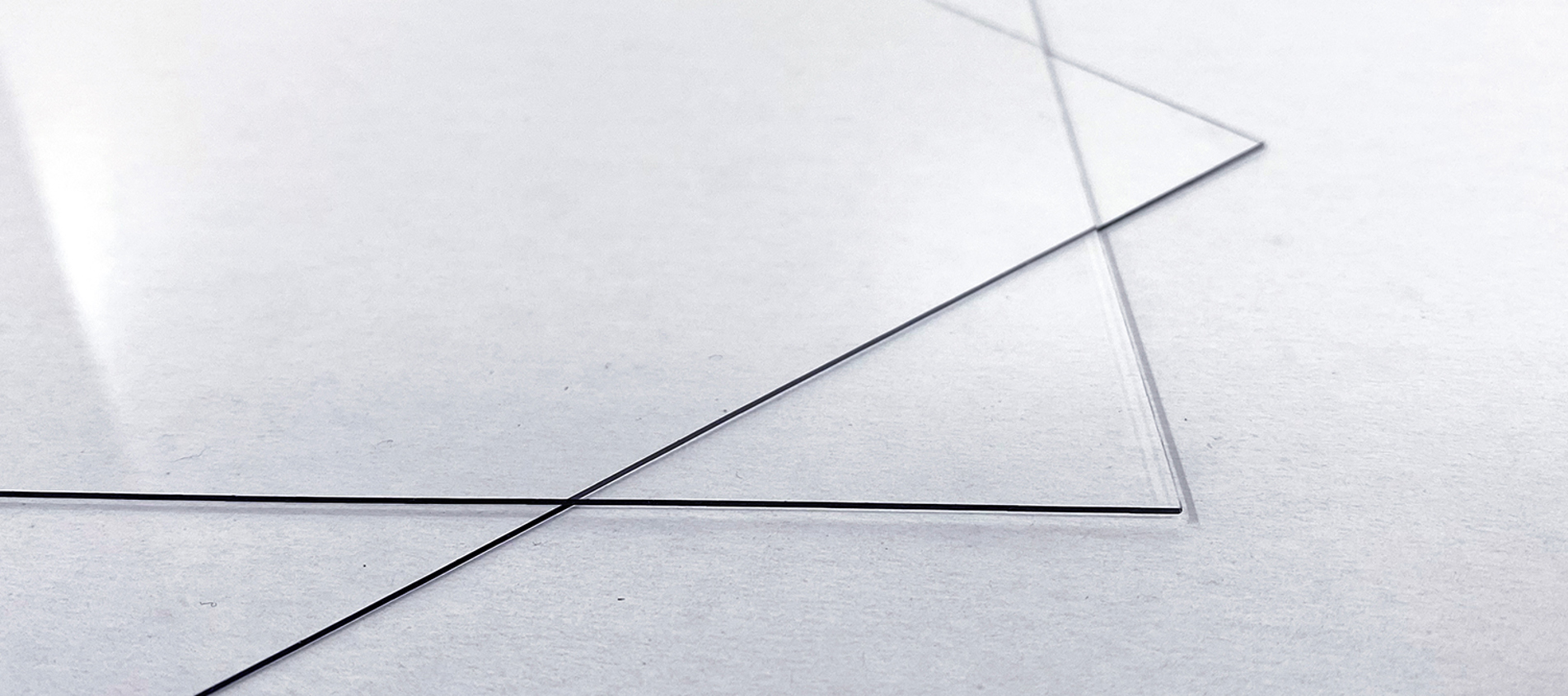 Clear PET plastic sheets on a white background