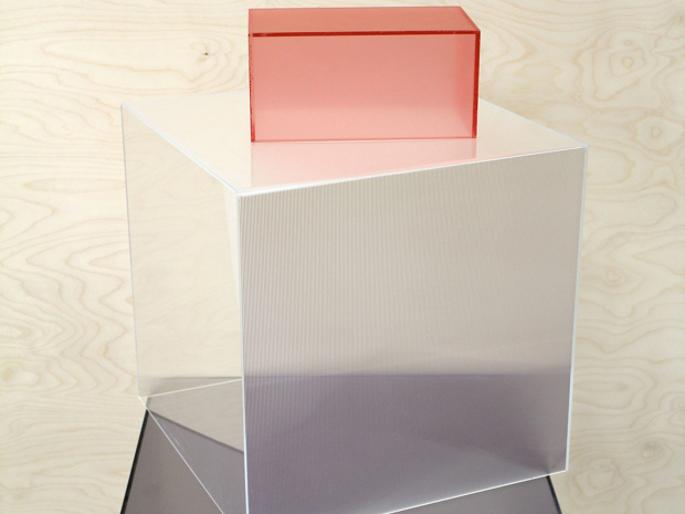 Three acrylic boxes in pink, clear and grey