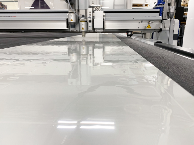 A thin boPET foil is being cut on a cutting plotter
