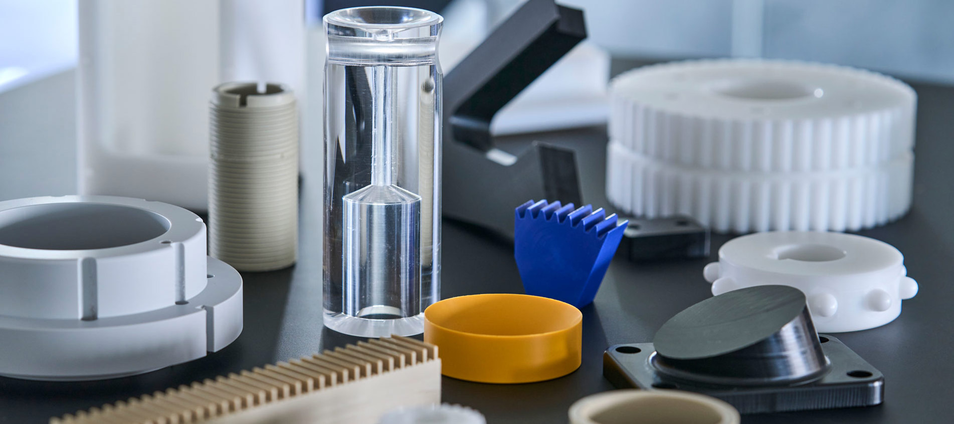 Machine parts of engineering plastics as PEEK, POM and nylon.