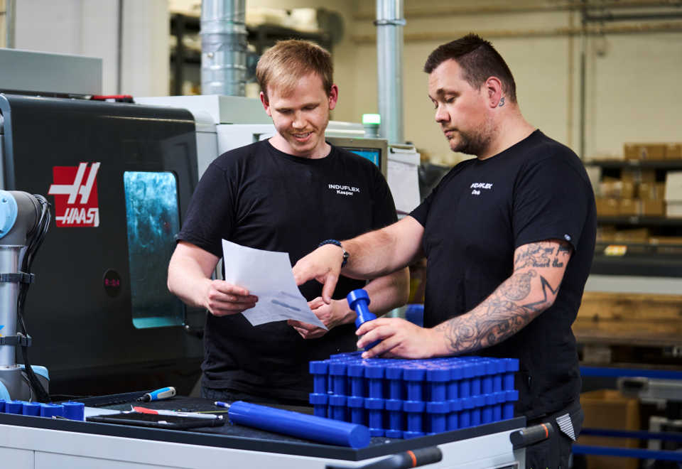 Two industrial technicians in the turning department.