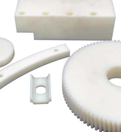 Five various machine parts made from white nylon