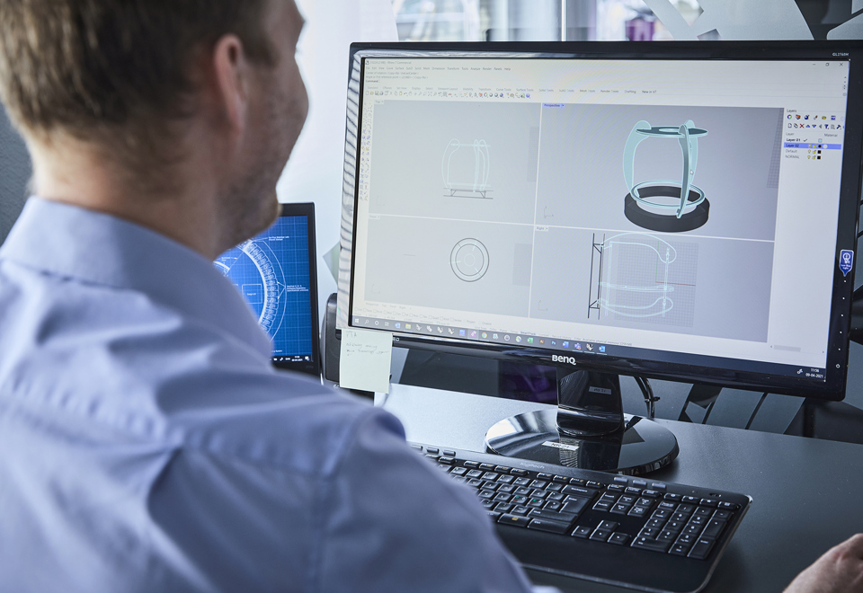 Construction of components for a lamp with a technical drawing on a computer
