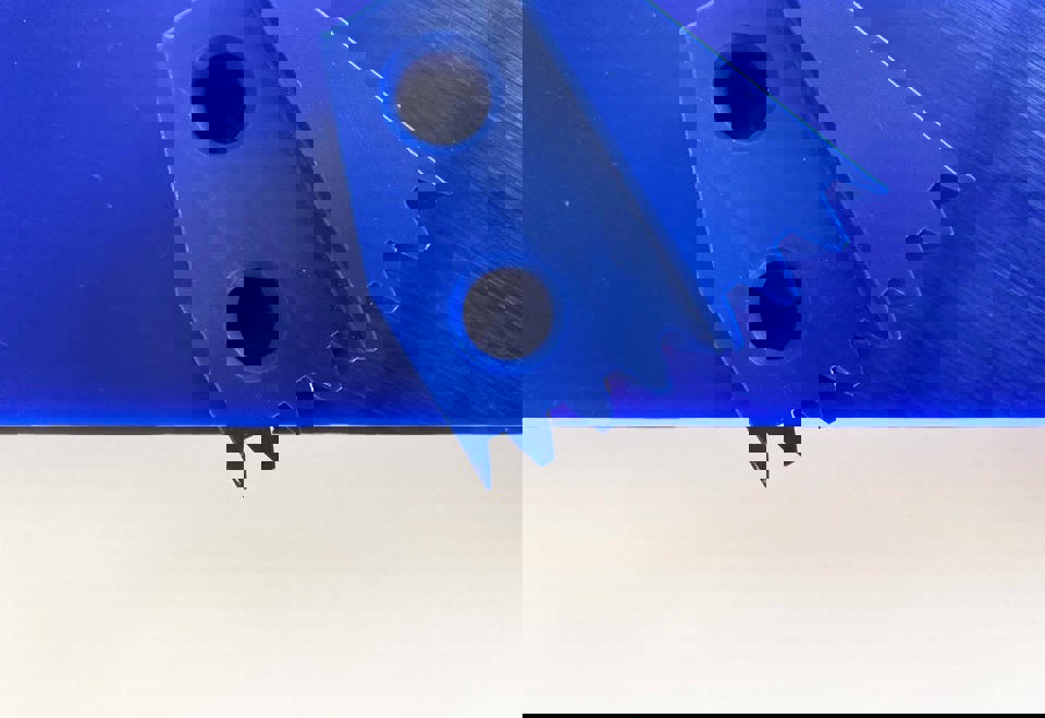 Two blue pieces of FCM-approved POM