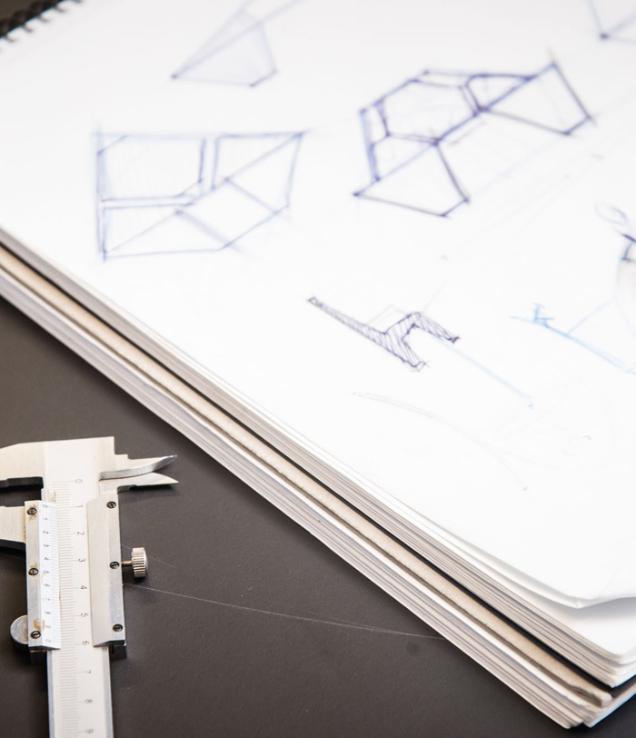 Technical drawing and small arms instructor lies on a table