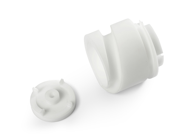 Two screws in white technical plastic from Induflex's CNC machining centre