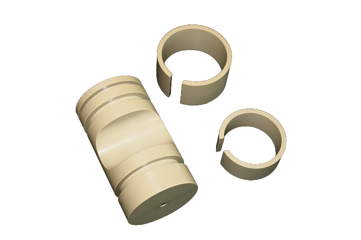 Maskindele i materialet PEEK.