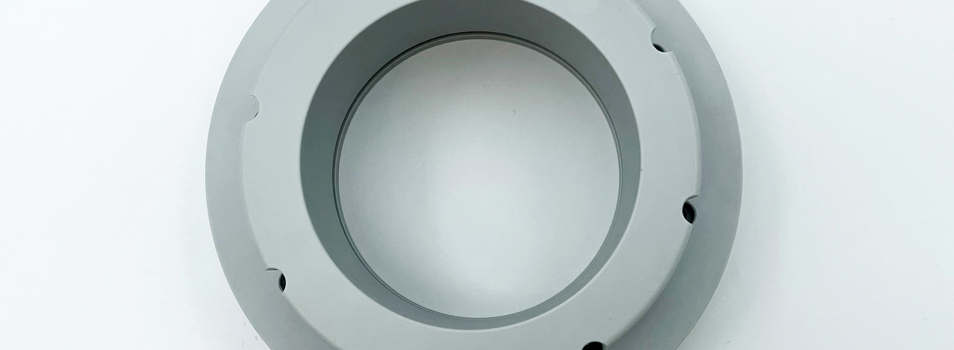 A grey object of PET-P with added Teflon to increase the slide ability 