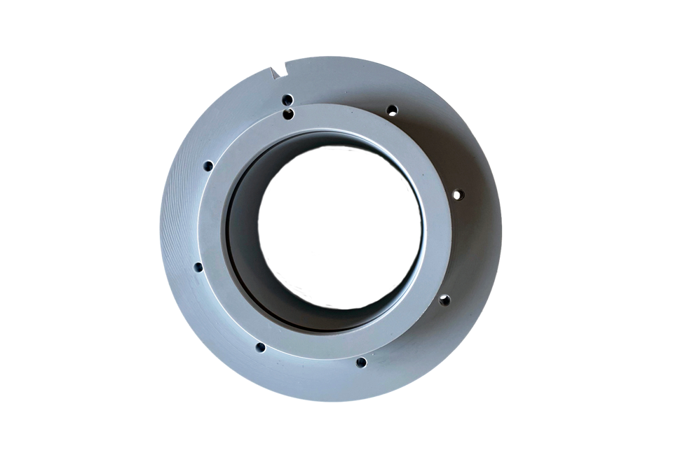 Et gråt PET-P emne, hvor der er tilsat Teflon for at øge glideegenskaberne