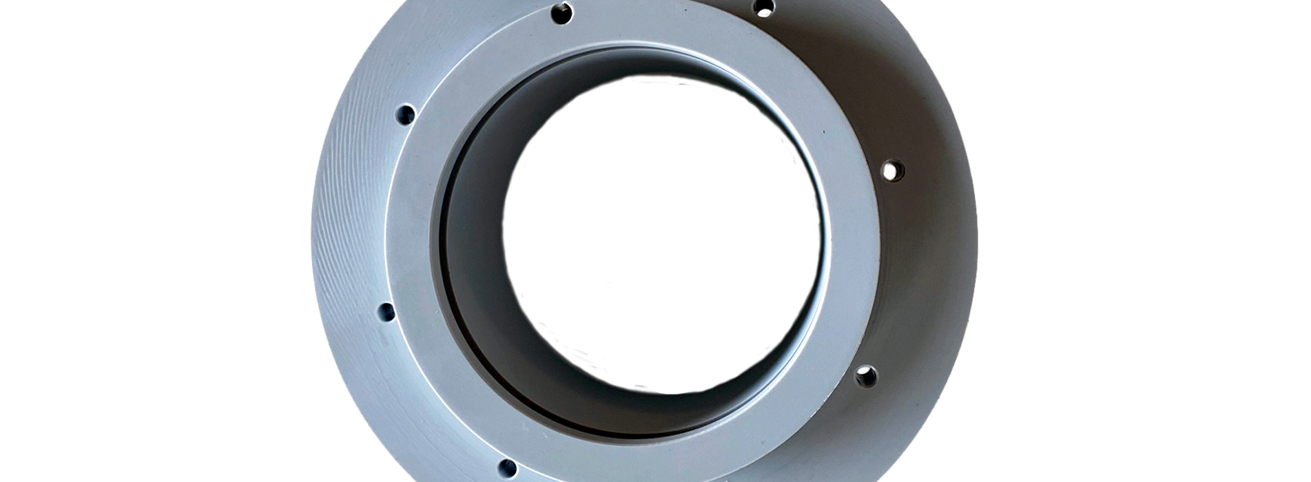 Et gråt PET-P emne, hvor der er tilsat Teflon for at øge glideegenskaberne